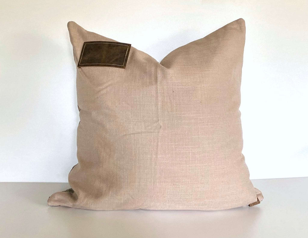 We have chosen a neutral linen blend and branded it with our unique hand-stitched leather patch and zipper tag.  Two possibilities in one pillow.   Oversized at 22”, they are a luxurious comfort that will always have your back.